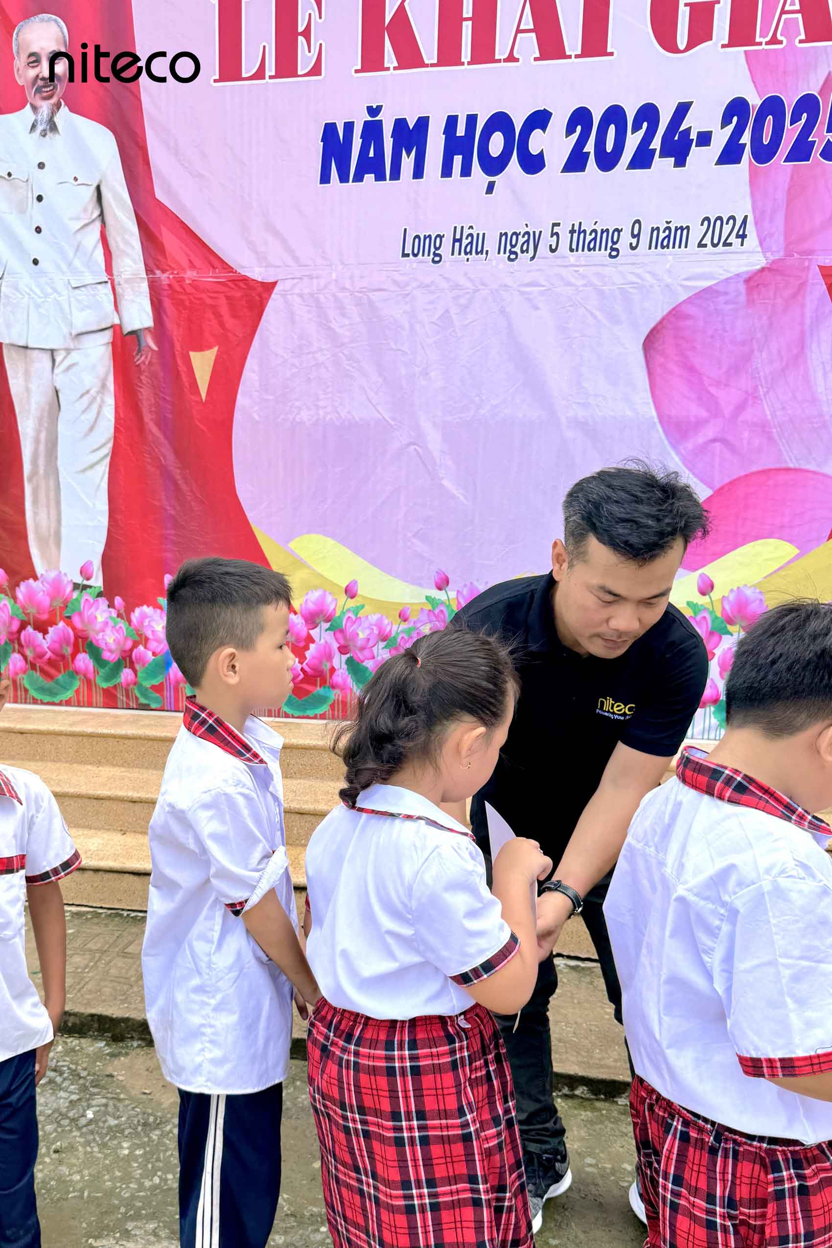 NICEF members help to hand out the gifts