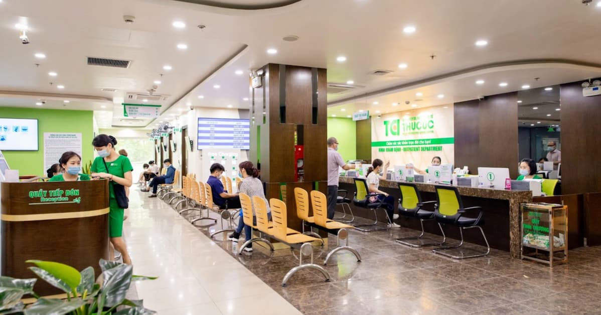 Hospital outpatient department with patients and staff wearing masks