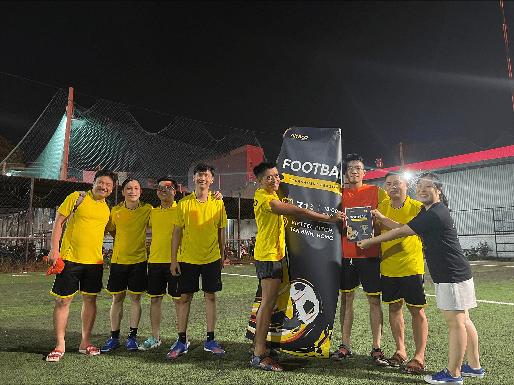 Football tournament team celebrating victory at Viettel Pitch, Tan Binh, HCMC