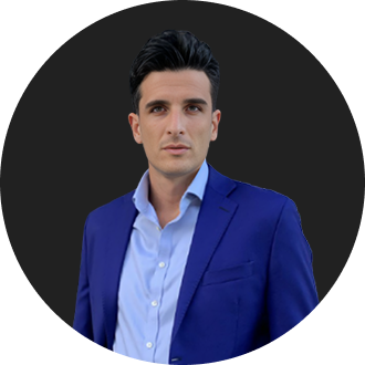 Professional man in blue suit and light blue shirt with confident expression