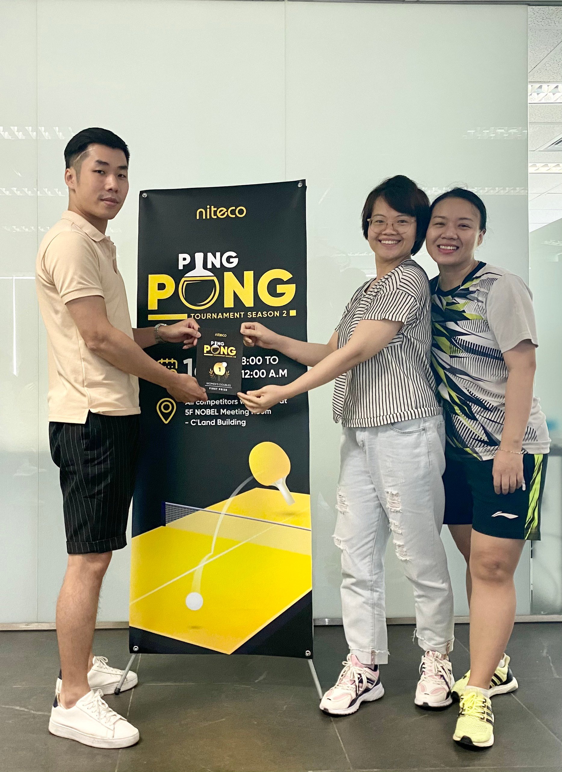 Three participants celebrating first prize in Niteco Ping Pong Tournament Season 2