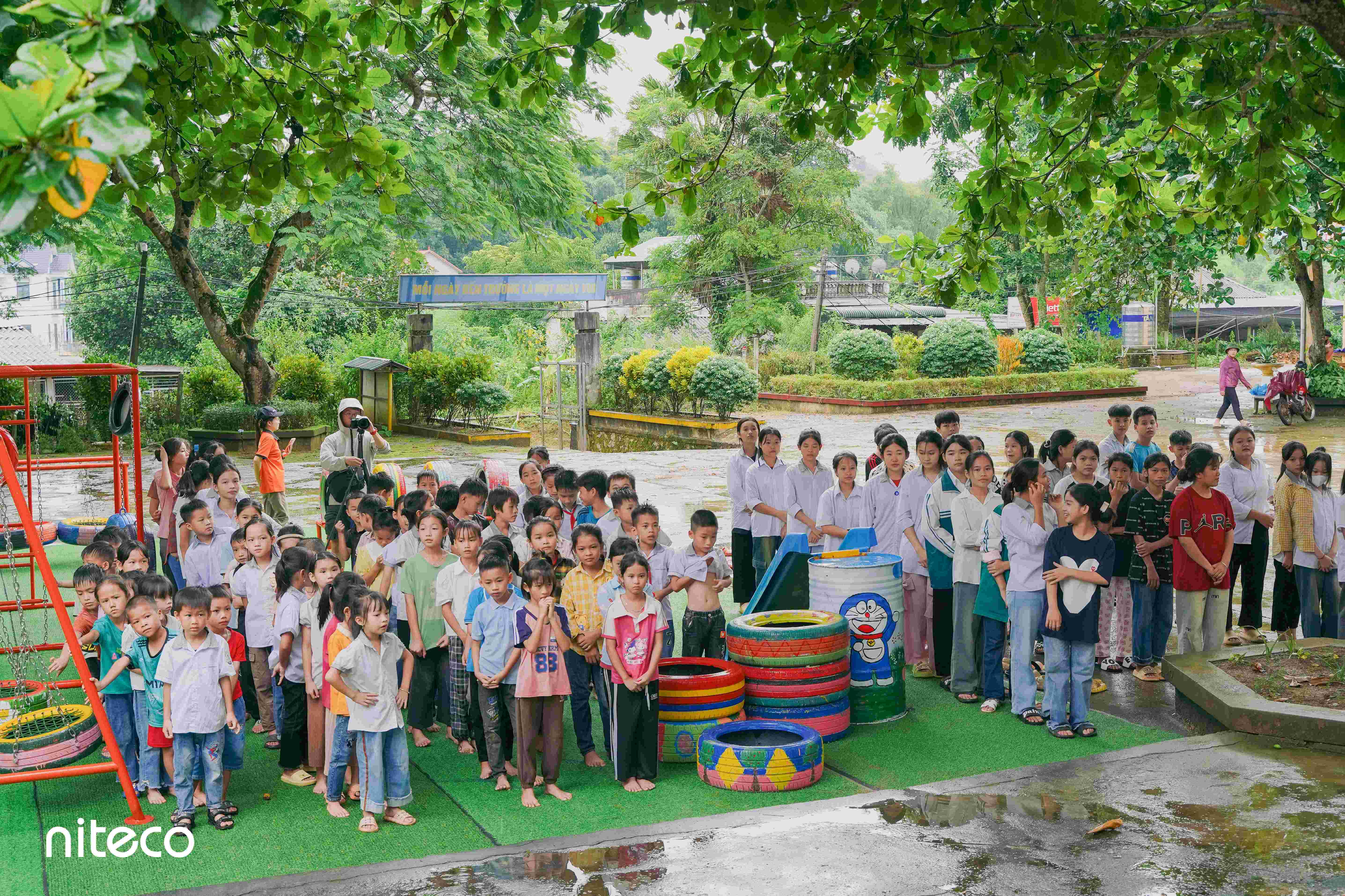 Children and teenagers gathered at playground during school outdoor activity