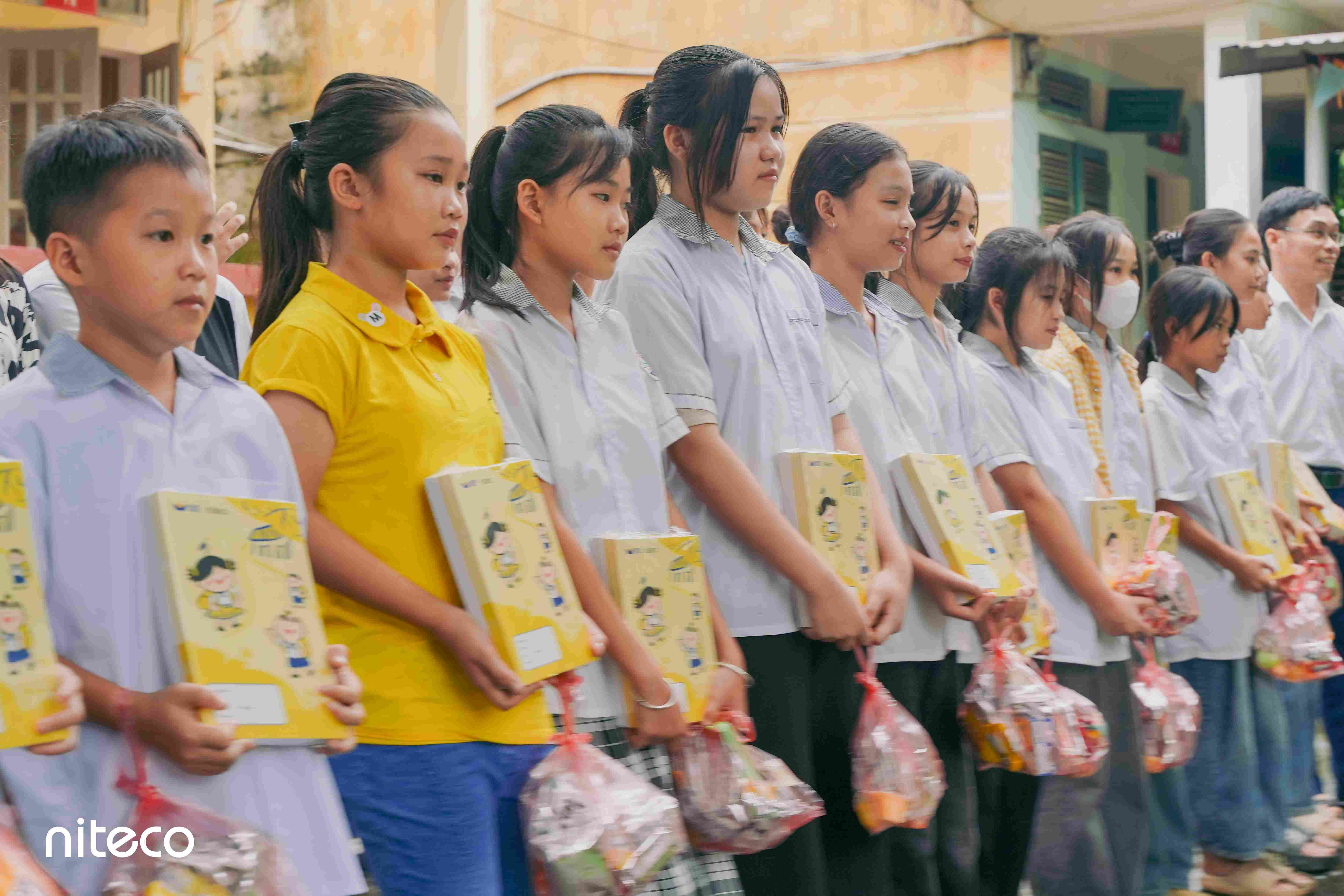 Students receive educational gifts and care packages during the school charity event
