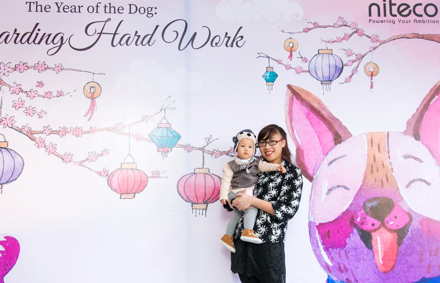 Mother and child celebrating the Year of the Dog with lantern decorations
