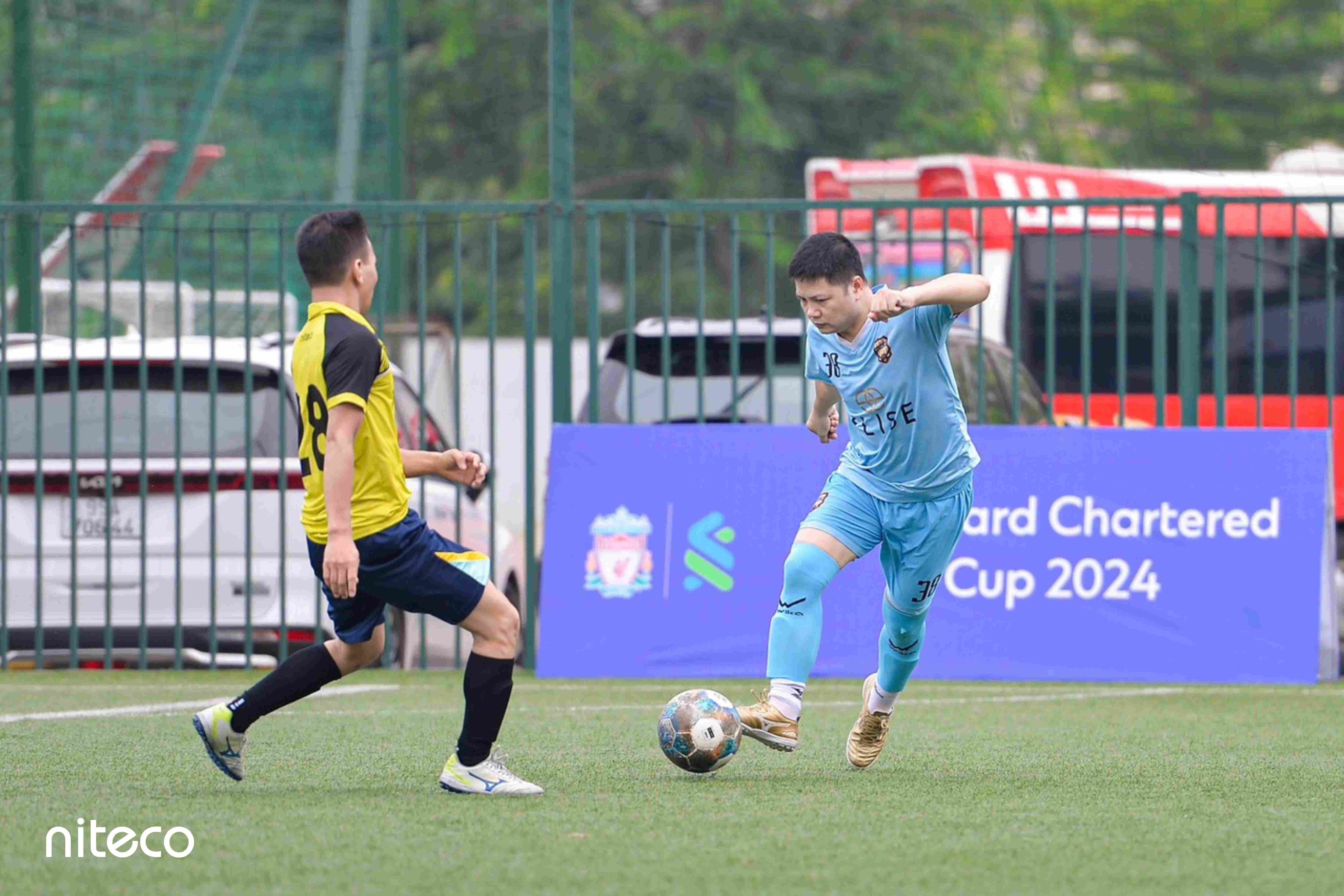 Football players competing in the Standard Chartered Cup 2024 match