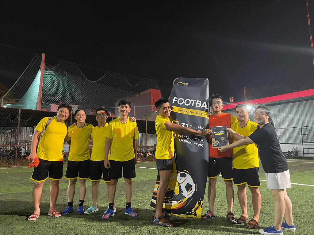 Football team celebrating victory at Viettel Pitch, Tan Binh, HCMC tournament