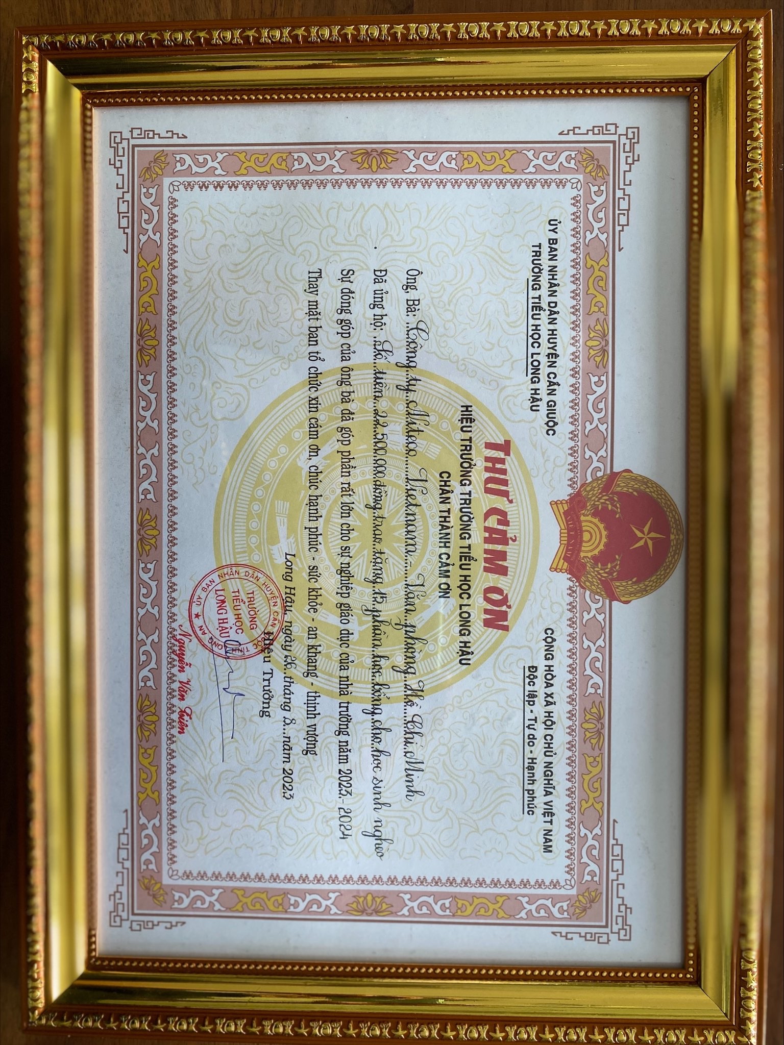 Thank you letter from Long Hậu Elementary School principal for donation support