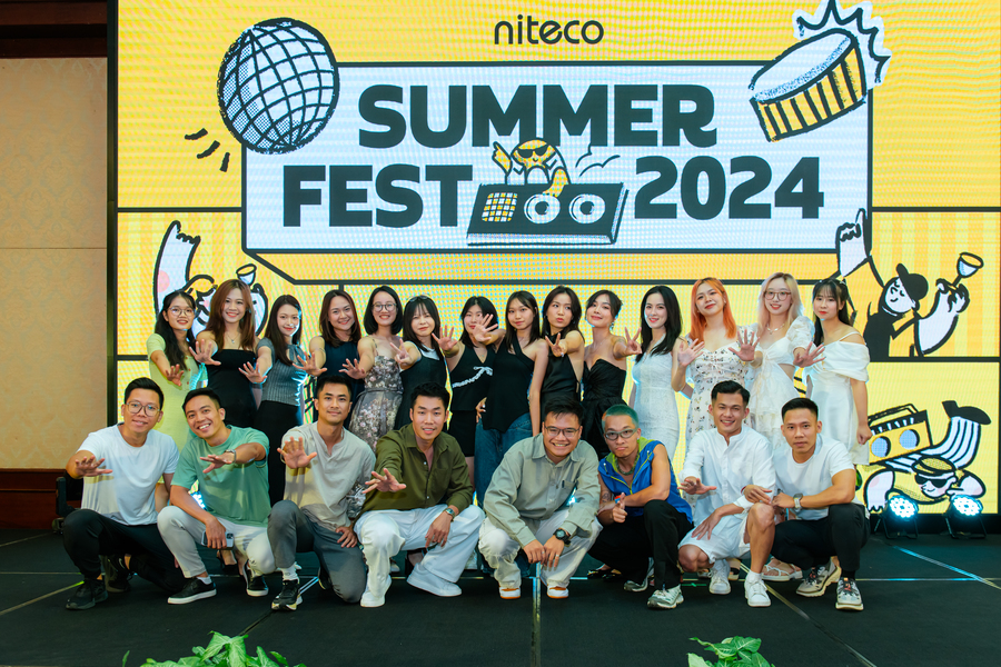 Niteco Summer Fest 2024 group photo with employees posing on stage