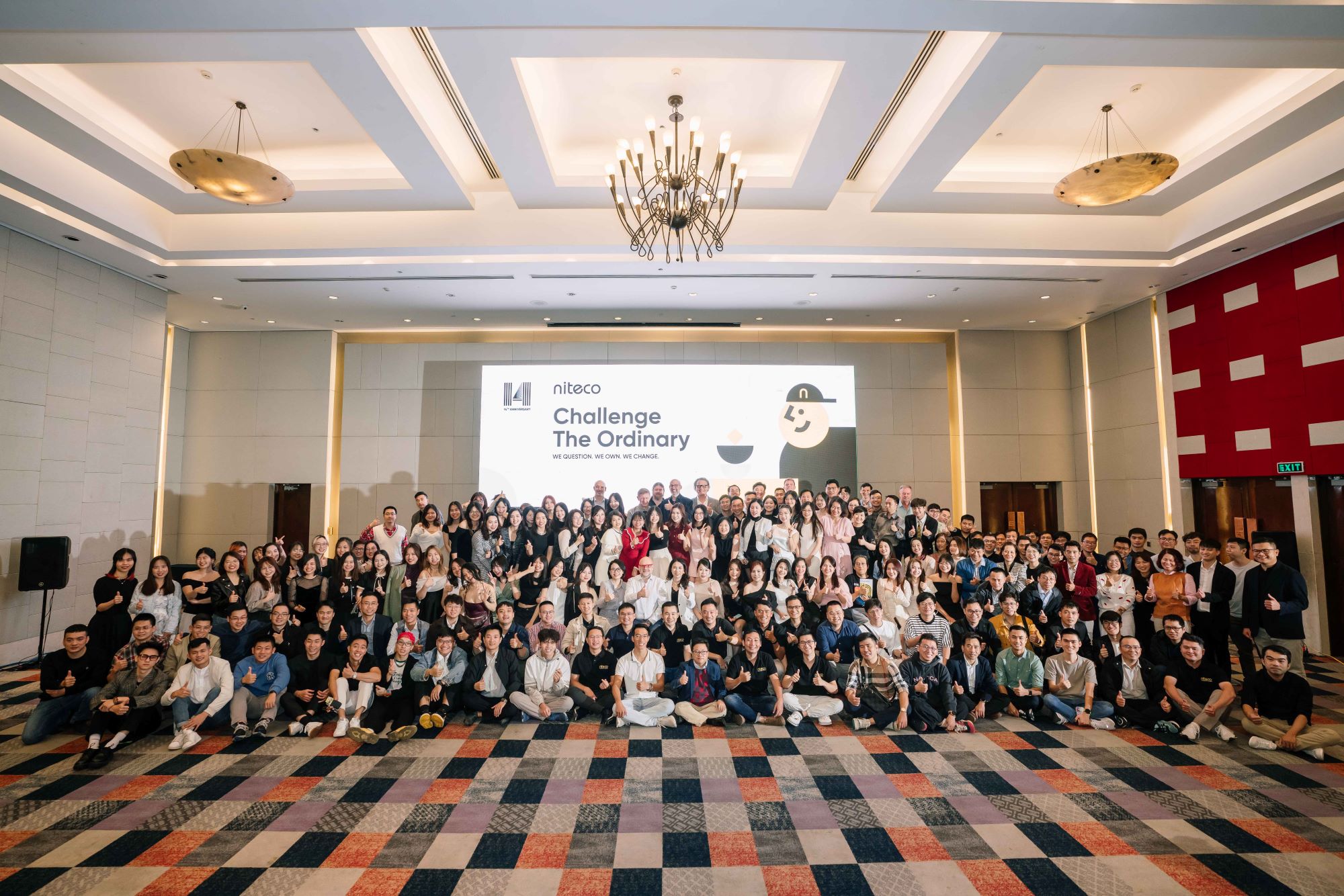 Niteco team gathered for "Challenge The Ordinary" corporate event group photo