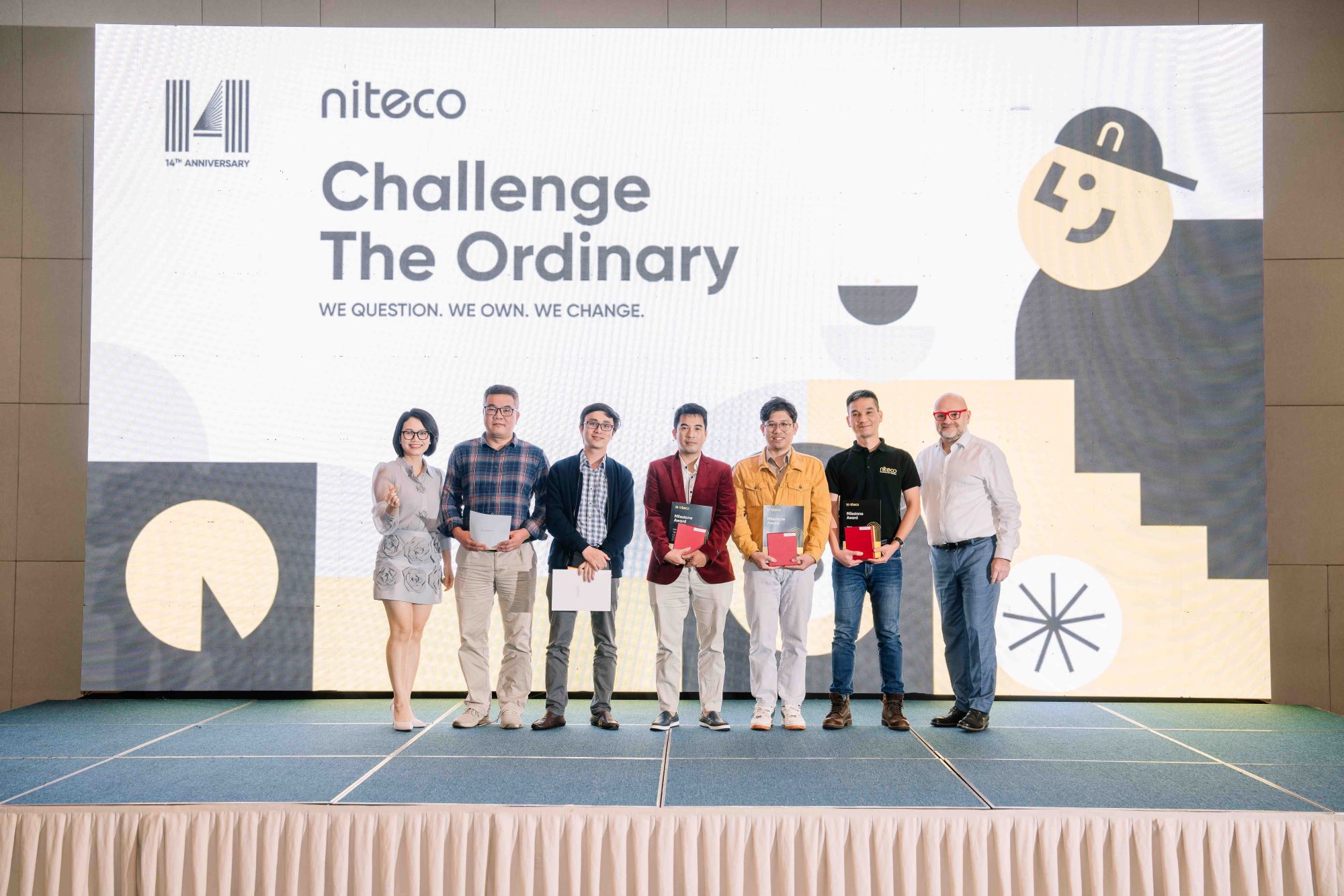 Niteco 14th anniversary event with Challenge The Ordinary award winners on stage