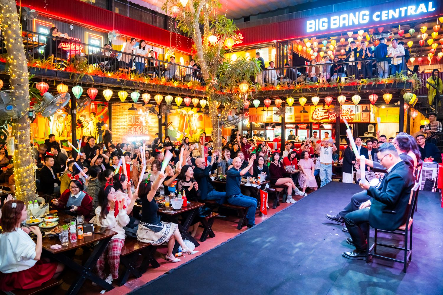 Big Bang Central lively night event with vibrant lanterns and cheering crowd