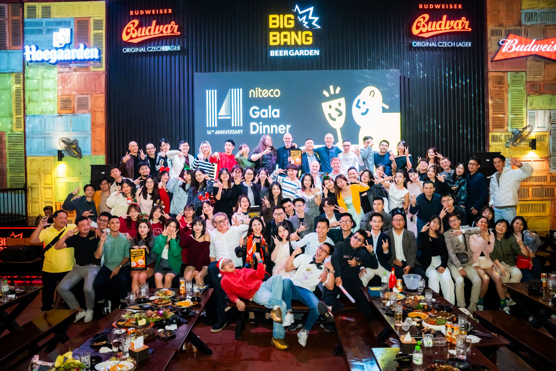 Niteco 14th Anniversary Gala Dinner group photo at Big Bang Beer Garden with food