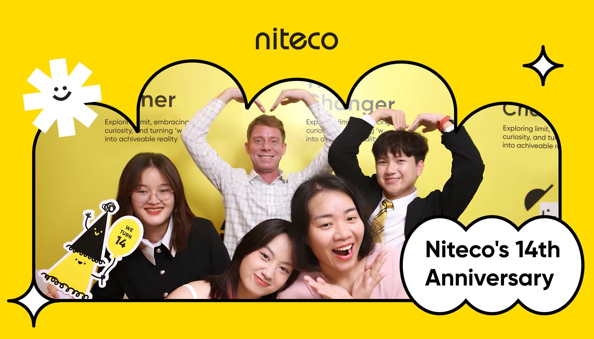 Niteco's 14th anniversary celebration with smiling team forming heart shapes