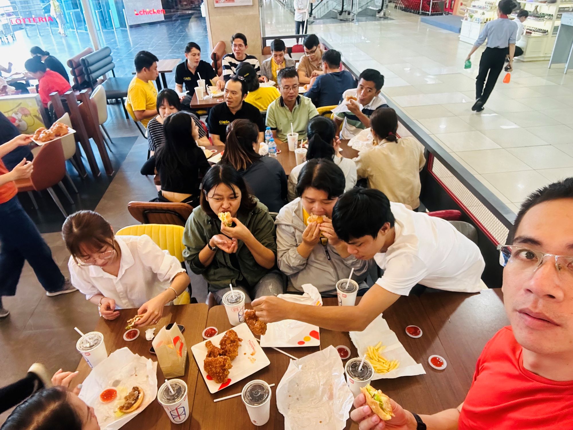 Group enjoying fried chicken and drinks together at a casual dining restaurant