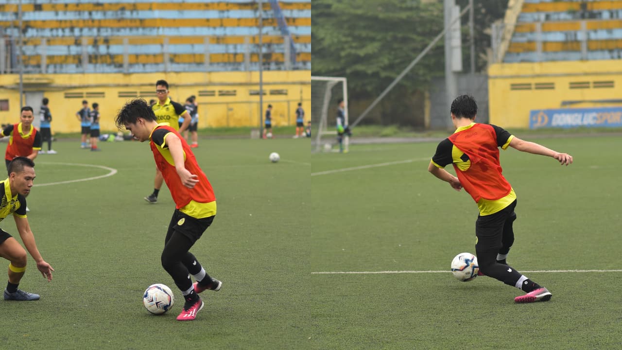 Players practicing soccer dribbling and ball control on a green turf field