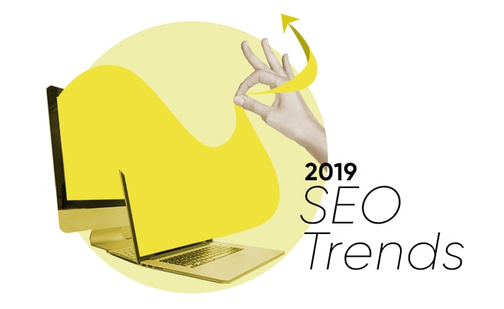 2019 SEO Trends with laptop and hand showing OK gesture and upward arrow
