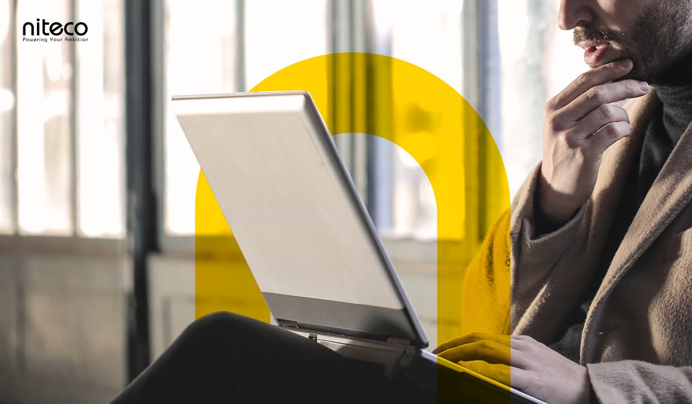 Alt text: Man working on laptop with digital security lock, emphasizing data protection