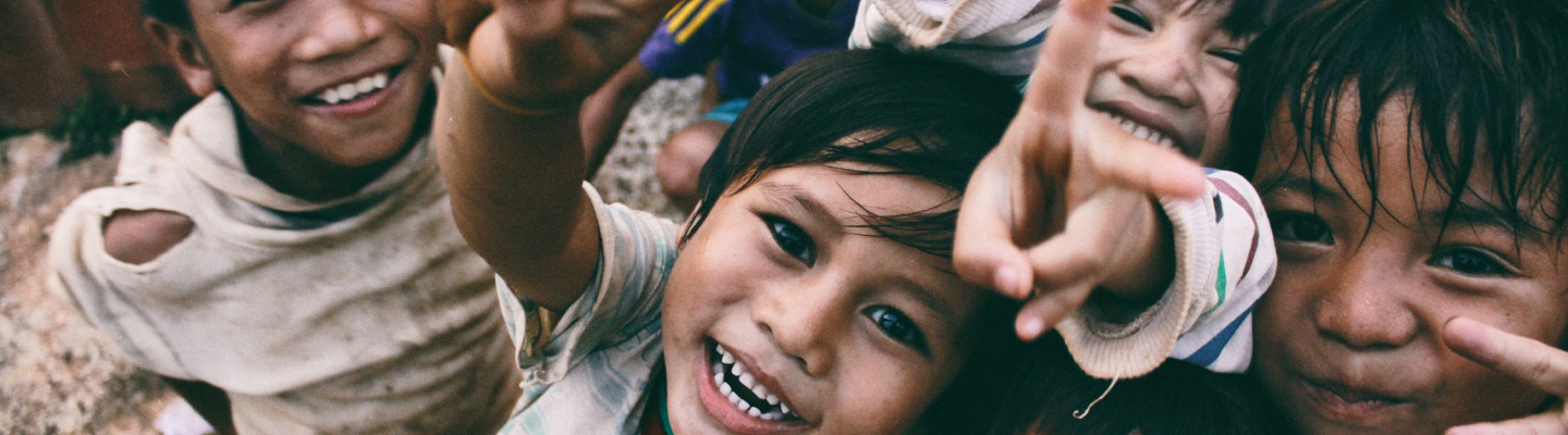 Happy children smiling and playing outdoors, reflecting community joy and unity