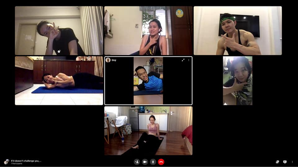 Virtual group workout session with participants exercising from home
