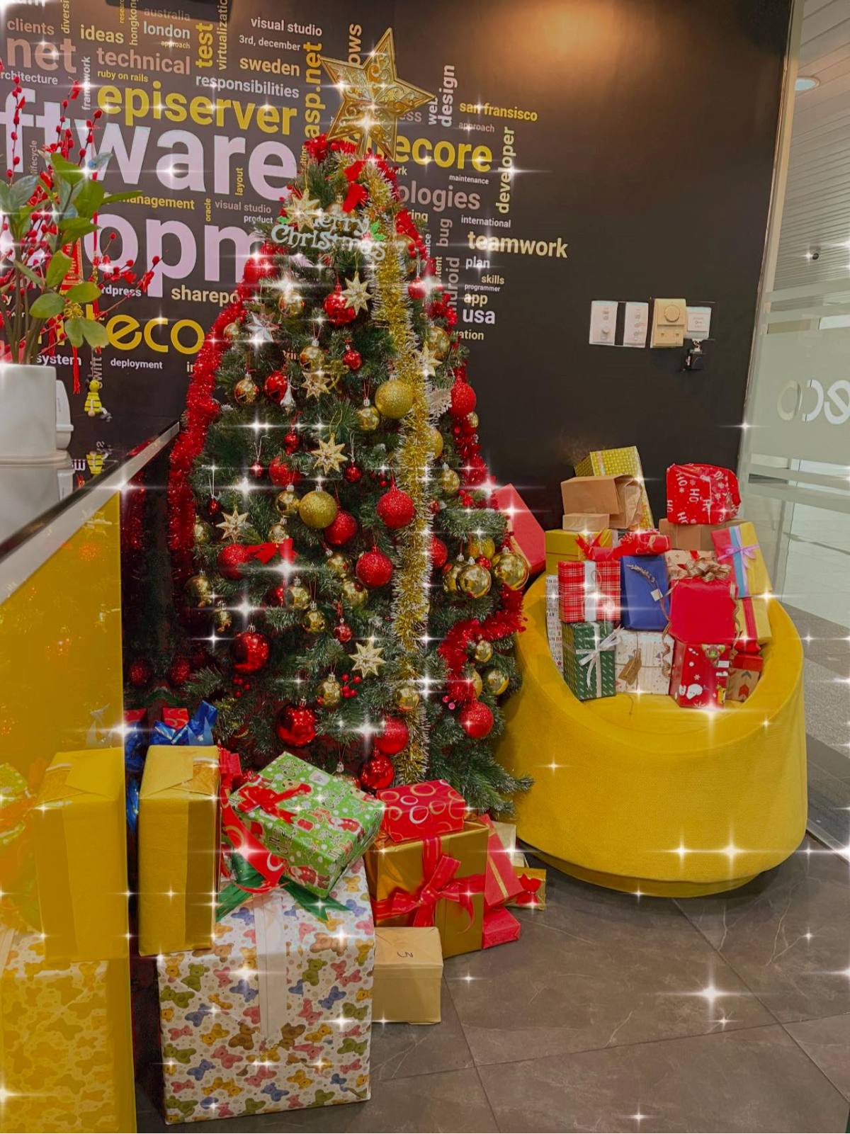Christmas tree decorated with red and gold ornaments and Christmas gifts