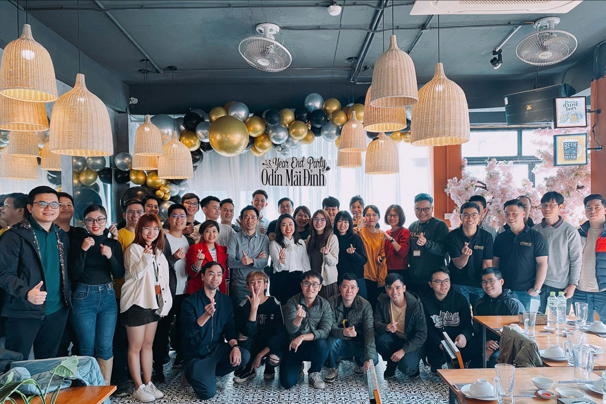 Year end party group at Odin Mai Dinh with festive balloons and decor