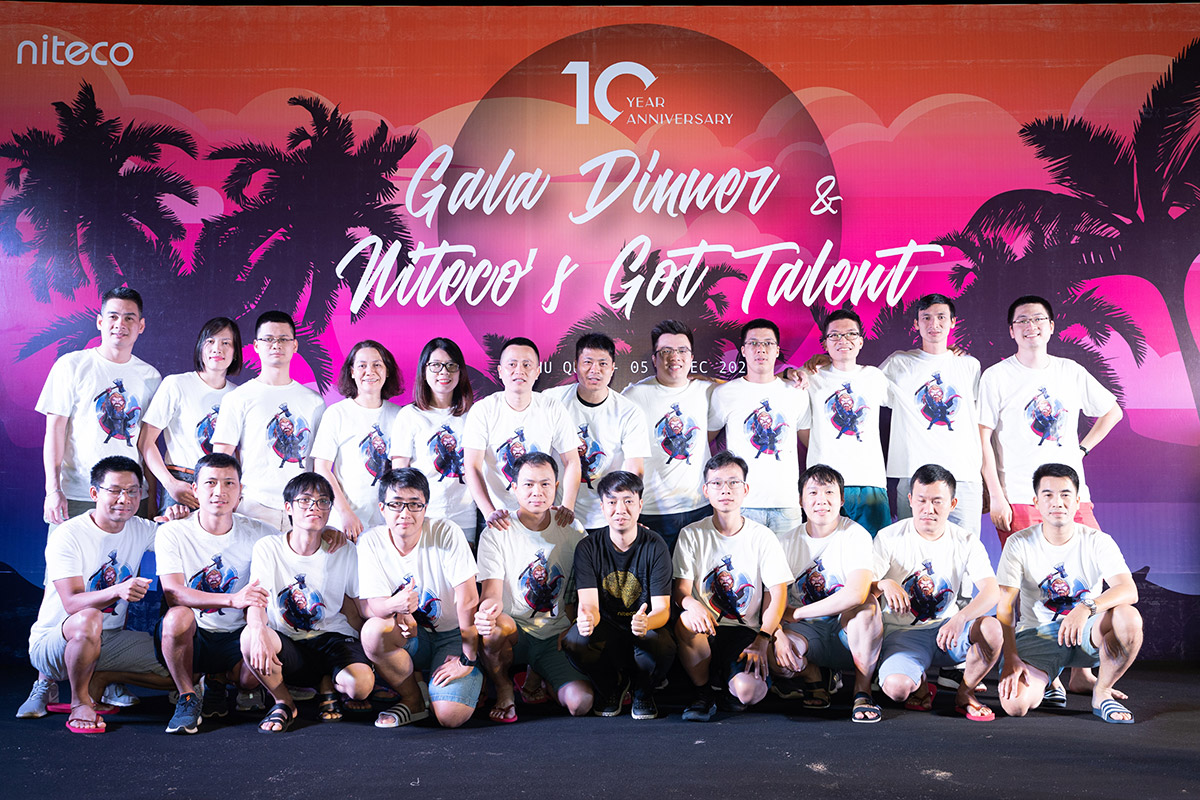 Niteco 10 Year Anniversary Gala Dinner team posing with matching event shirts