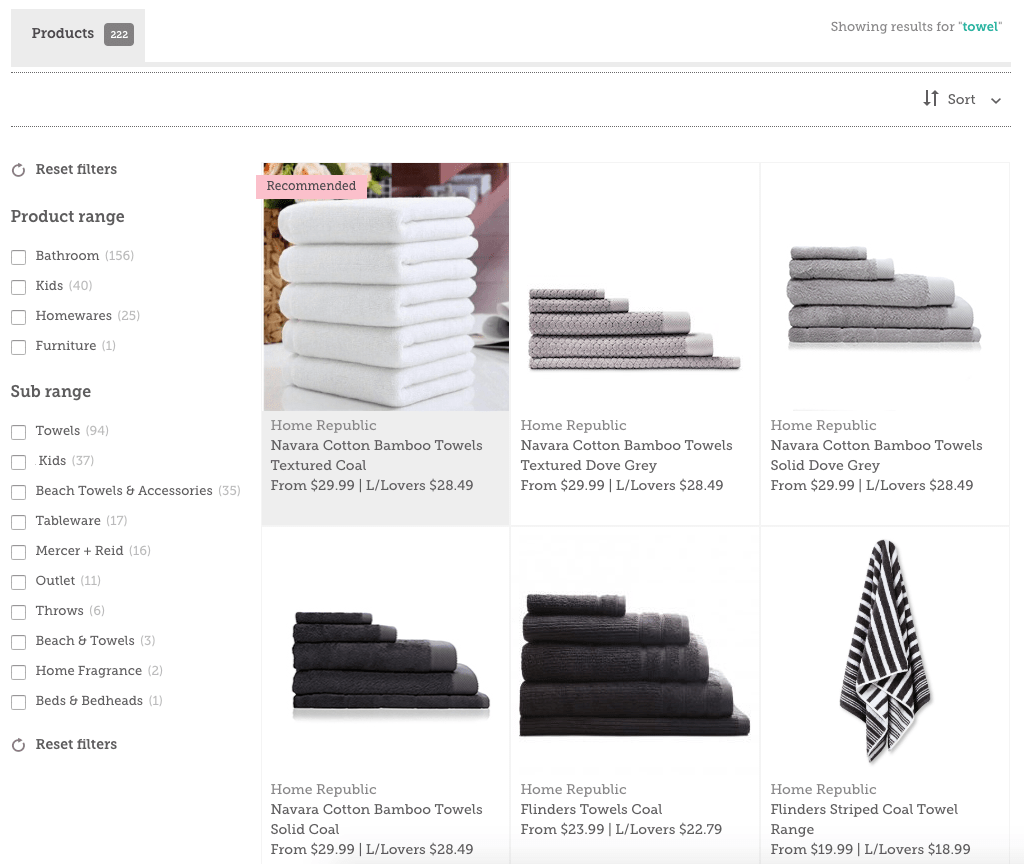 Stacked Navara Cotton Bamboo Towels in white, grey, and coal colors from Home Republic