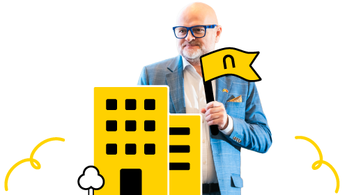 Business professional holding a flag near yellow office buildings with clouds