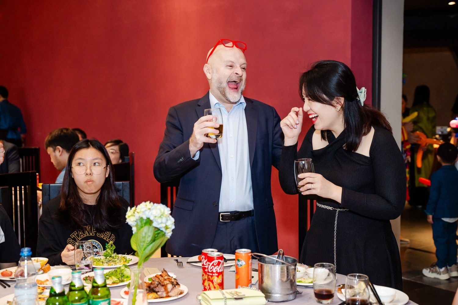 Diverse group enjoying drinks and food together at social gathering party