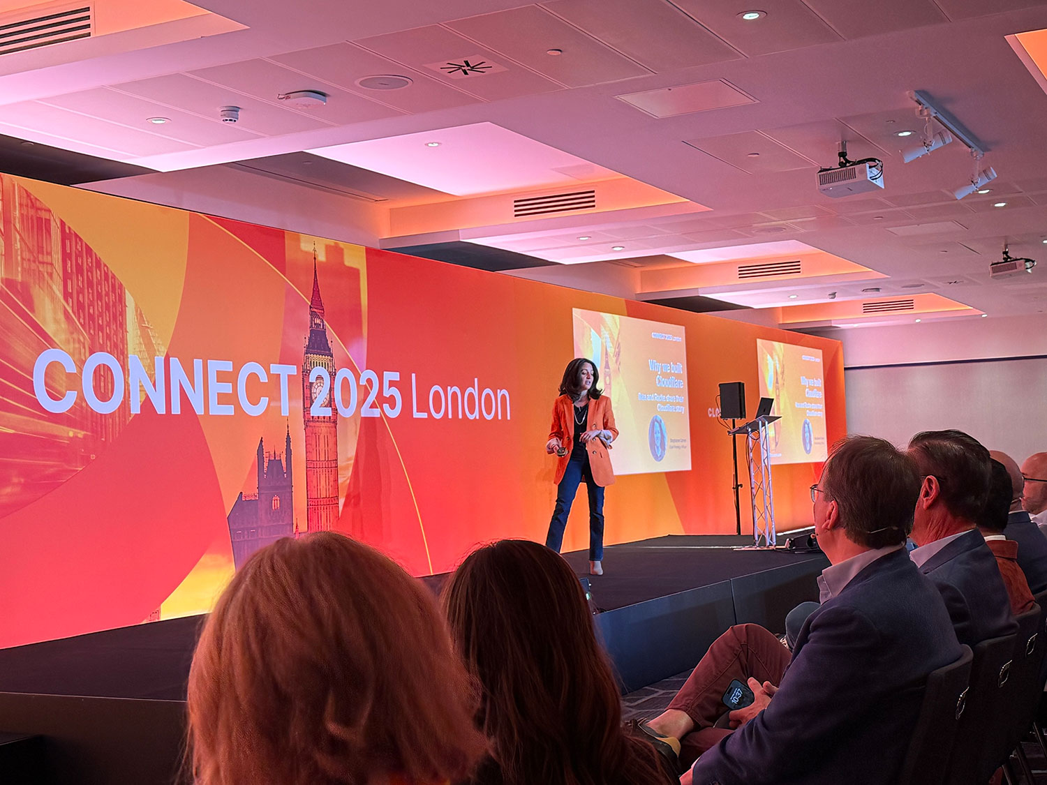 CONNECT 2025 London conference stage with speaker presenting to audience